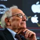 Warren Buffett analyzing stock market trends, illustrating his recent strategic Warren Buffett stock investment decisions.