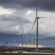 Wind farm operator's halted project showing partially built turbines amid regulatory uncertainty