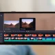 Adobe Premiere iPhone app showing professional video editing interface with timeline and AI tools