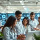 Professionals developing essential AI career skills through collaborative technology integration