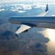 Commercial airliner during airline Mexico expansion over Mexican coastline