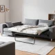 Comfortable gray loveseat sofa bed perfect for small spaces and guests