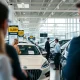 American consumers facing record new car prices at modern dealership showroom