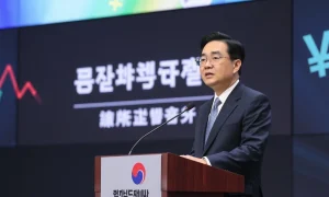Bank of Korea Governor discussing won-pegged stablecoin concerns at financial conference