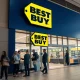 Best Buy customer service representatives assisting shoppers in modern retail environment