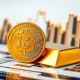 Bitcoin store of value comparison with gold bars showing digital versus traditional safe haven assets
