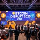 Bitcoin World Disrupt 2025 conference stage with tech leaders discussing startup scaling strategies