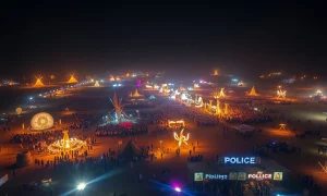 Burning Man homicide investigation scene with police lights at desert festival
