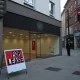Empty retail store illustrating the devastating impact of business rates rise on UK high streets