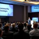 Tech leaders discussing community-first design strategies at StockPil Disrupt conference