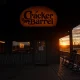 Cracker Barrel closing locations with empty dining room and closed sign visible