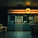 Fast-food chicken chain closures show empty restaurant with closed sign during business downturn