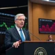 Federal Reserve official discussing interest-rate cuts during economic policy meeting