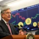 Jerome Powell discussing Fed rate cut implications during Federal Reserve press conference