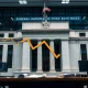 Federal Reserve officials discussing critical rate cut decision amid economic data analysis