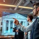 Federal Reserve Governor discussing Fed rate cuts impact on financial markets and cryptocurrency growth