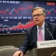 Federal Reserve official discussing interest rate cuts during economic policy meeting