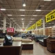 Empty furniture showroom during Chapter 11 bankruptcy liquidation with closing signs