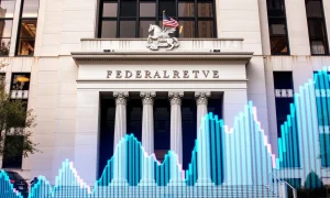 Chicago Fed President discussing Fed rate cut decision during economic policy briefing