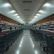 Empty grocery store showing recent closures with shopping carts abandoned in aisles
