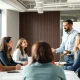 Priya Morioka demonstrating inclusive leadership during a diverse team meeting discussion