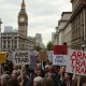 London arms fair protest with diverse demonstrators holding anti-weapons trade signs
