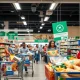 Membership-based grocery store interior showing shoppers enjoying exclusive savings and bulk products