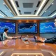 Corporate Bitcoin acquisition strategy meeting with investment charts and data visualization
