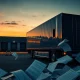 Semi-truck company filing Chapter 11 bankruptcy with financial documents scattered at empty loading dock