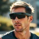 Athlete wearing Oakley Meta Vanguard smart glasses during intense workout with integrated AI technology