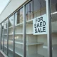 Closed office supply retailer storefront showing business restructuring after massive closures