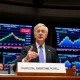 Jerome Powell discussing labor market trends at Federal Reserve hearing with economic data visuals