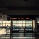 Regional airline exits airport showing empty gates and canceled flight displays