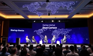 Silicon Valley startups debate panel at tech conference with global map background