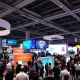 Startup exhibition at StockPil Disrupt 2025 tech conference with entrepreneurs showcasing innovations
