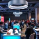 Entrepreneurs showcasing innovations at StockPil Disrupt 2025 exhibition tables to investors and attendees