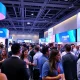 Entrepreneurs networking at StockPil Disrupt 2025 conference with vibrant atmosphere