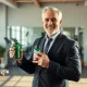 Joe LoGalbo holding TestoGreens MAX supplement for men's health and vitality
