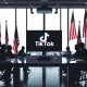 American business leaders discussing TikTok takeover deal in corporate boardroom