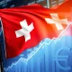 UBS cutting EUR/CHF targets amid Swiss Franc surge in currency markets