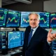 Veteran analyst presenting surprising Apple stock analysis with market charts and data visualization