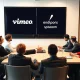 Vimeo takeover announcement showing corporate executives finalizing the $1.38 billion acquisition deal