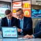 Corporate executives analyzing critical consumer spending trends data during business strategy meeting