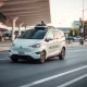 Waymo robotaxi providing autonomous transportation service at San Jose International Airport terminal