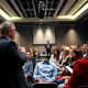 Professional speaker engaging audience at business event to hire the right speaker
