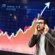 Investor making emotional decisions during market rally showing poor timing