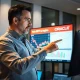 Financial analyst discussing Oracle stock forecast with performance charts