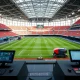 Automated sports venue operations with robotic field marking and digital management systems