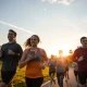 Strava IPO announcement showing diverse runners using the fitness app in urban setting