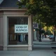 A closed boutique storefront after filing for Chapter 7 bankruptcy, symbolizing the end of a 20-year retail business.
